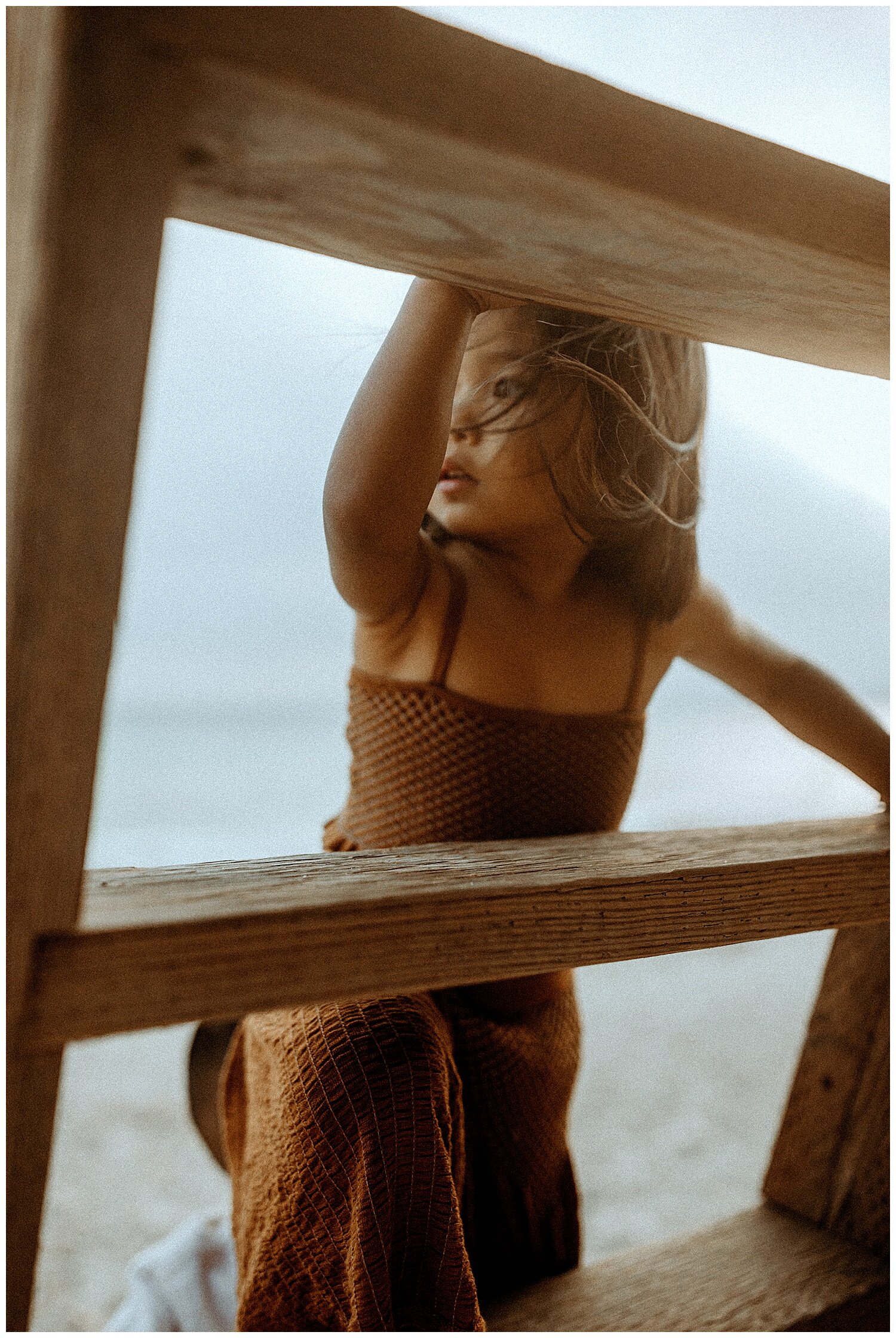 girl climbing ladder during family photo shoot in Los Angeles, California