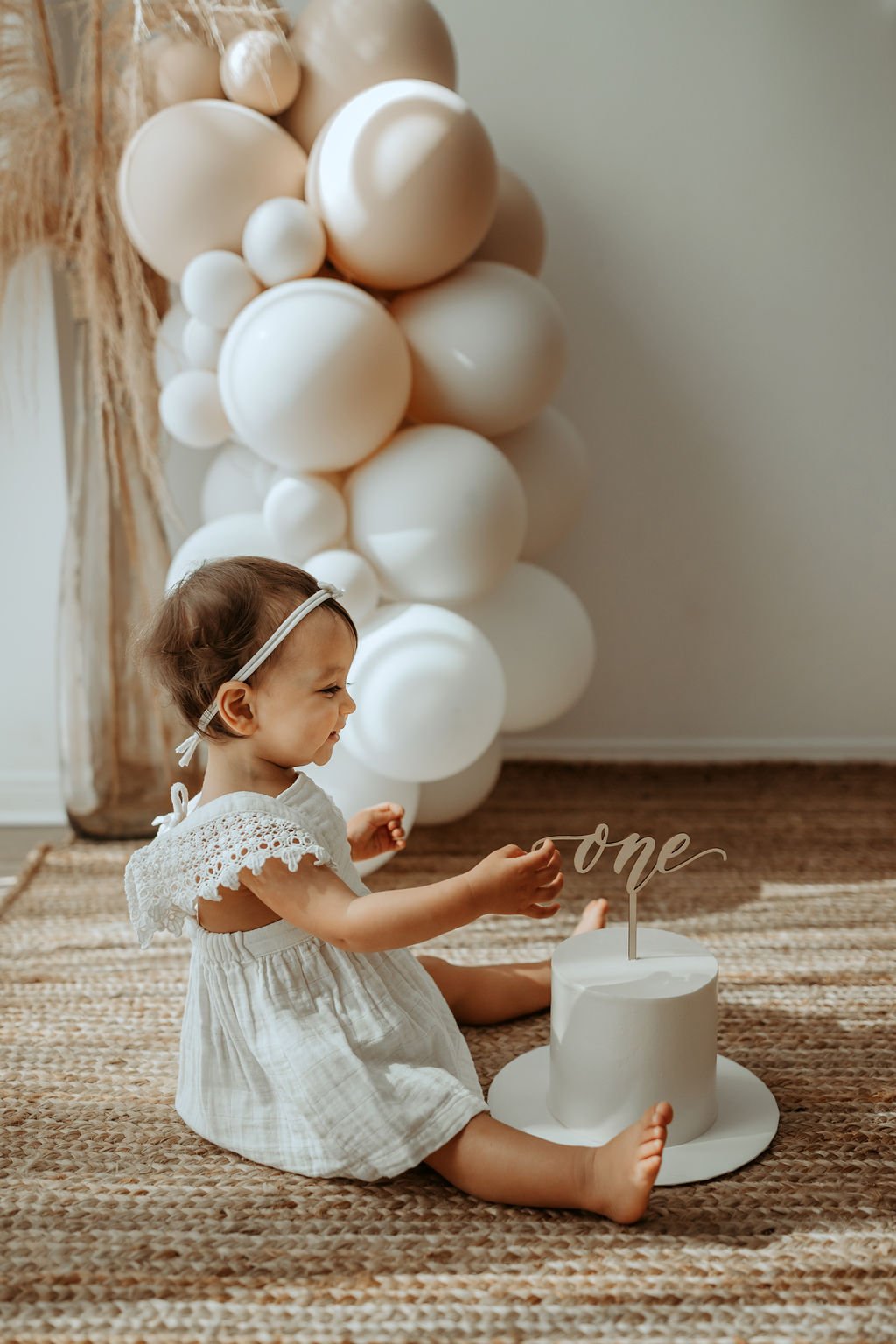 baby, cake, smash, girl, kate, baby, in, studio, in studio, milestone, photo, session, milestone photos, neutral colors, beige photo, authentic photos, candid photos, cake, cake baby, cake smash blog, cake smash ideas, cake smash photography tips,